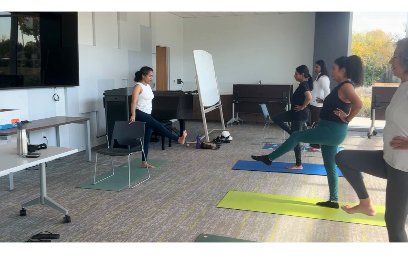 Riddhi leading a workplace movement session