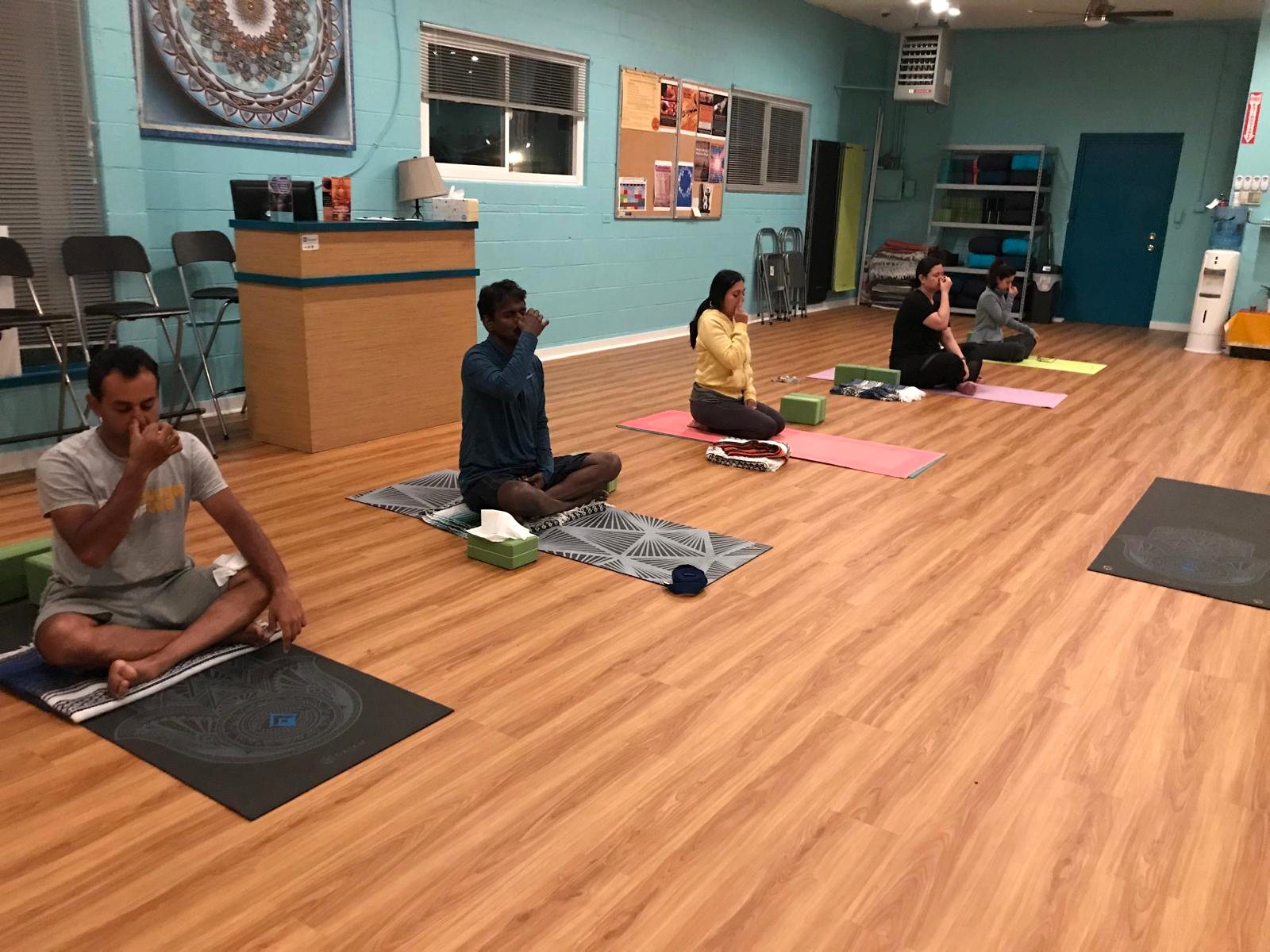 Participants in a guided restorative group class