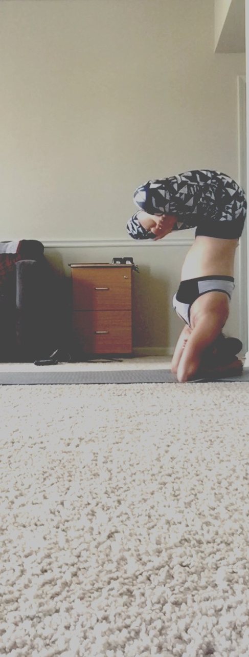 Riddhi practicing a supported inversion